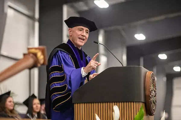 AU President Carlos 坎波 speaking at 2024 commencement